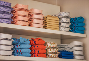 Men shirts in a clothing store - shopping concept