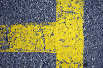 Yellow road warning line on the asphalt road. For background