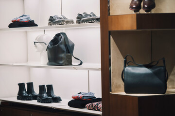Shoes and handbags in a store - shopping concept