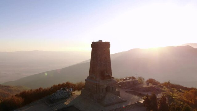 Stone Tower Of Shipka Monument During Beautiful Sunset - Liberty Memorial In Shipka Pass, Balkan Mountains In Bulgaria. - aerial orbit