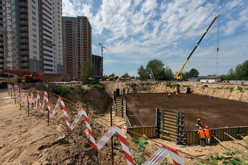 Installation of the foundation of the house at the construction site