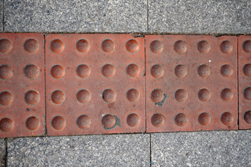 Visually impaired sign located on the ground