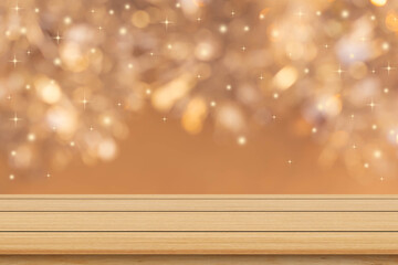 abstract blur beautiful glowing gold color background with light of  glittering star and wood table...