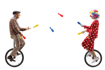 Elderly man and a clown riding unicycles and juggling © Ljupco Smokovski