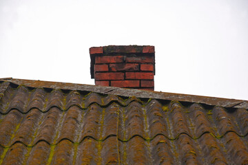 typical brick chimney on an old roof