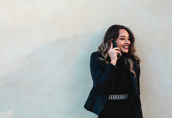 Business woman outdoors with cellphone.