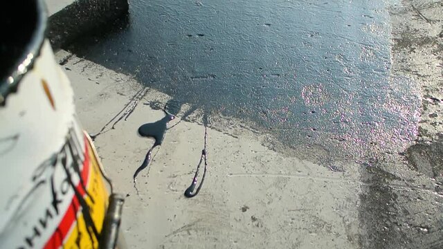 Roofer team lay black roofing material on white flat roof. Aerial view pattern texture concrete