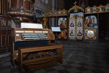 Interior of Roman Catholic Church of Nativity of the Blessed Virgin Mary in Komarno, Lviv region, Ukraine. Modern organ console
