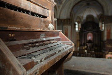 Fototapeta na wymiar Roman Catholic Church of Nativity of the Blessed Virgin Mary in Komarno, Lviv region, Ukraine. Ancient organ console