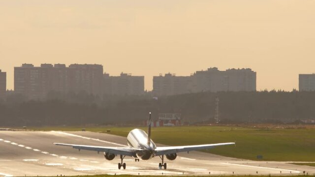 Airliner landing in the morning light.
