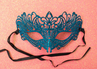 Female carnival mask on a red background. Mystery, incognito, seduction concept.