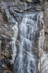 Fototapeta na wymiar large waterfall in mountains 