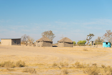 Mud straw and wooden hut with thatched roof in the bush. Local village in the rural Caprivi Strip,...