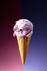 Blueberry ice cream in waffle cone.