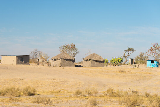 Mud straw and wooden hut with thatched roof in the bush. Local village in the rural Caprivi Strip, the most populated region in Namibia, Africa.