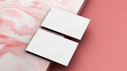 Business card mockup on a pink marble surface. Branding design concept