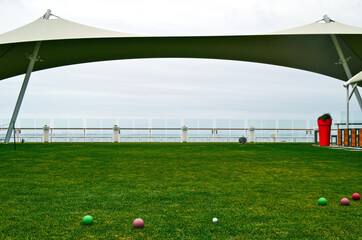 Outdoor meadow or lawn grass area on deck of modern cruiseship or cruise ship liner