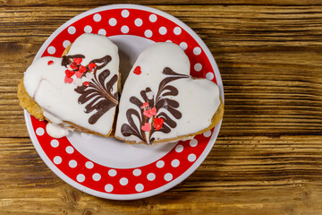 Heart shaped cookies on wooden table. Top view. Dessert for Valentine day