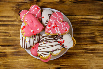 Heart shaped cookies on wooden table. Top view. Dessert for Valentine day