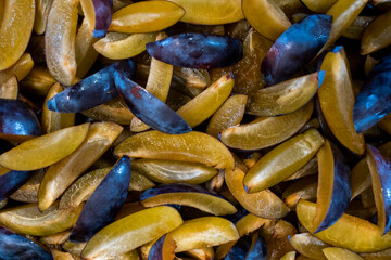 fresh plum cut into pieces, slices. Part of the recipe for plum jam.