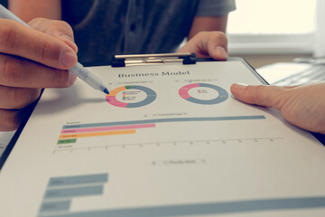 Businessman working with diagrams. Close up of hands and documents. Online education.