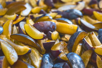 fresh plum cut into pieces, slices. Part of the recipe for plum jam.