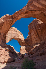 Visitors at Double Arch, Arches National Park