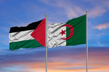 Palestine and algeria flag waving together in blue sky