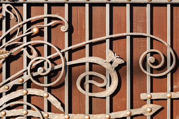 Elements of original forged patterns on the fence