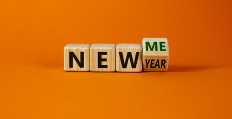 New me symbol. Turned a cube and changed words 'new year' to 'new me'. Beautiful orange background. Copy space. Business and new year - new me concept.