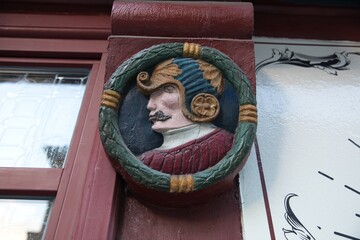 Wooden Exterior Wall Carving of Man with Mustache Profile