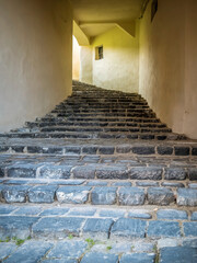 Cobblestone stairs tunnel in the medieval town of Sighisoara, Romania.