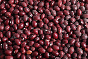 Closeup of raw red beans (caricas) viewed from above