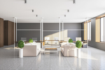 Minimalistic waiting room with computers, two sofa and city view.