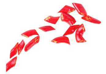 Red chopped chili peppers isolated on a white background, top view. Sliced red hot chili peppers.