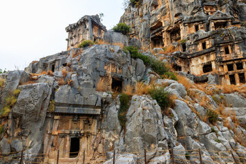 Fototapeta premium Rock-cut tombs of Lycian necropolis of the ancient city of Myra in Demre, Antalya province in Turkey