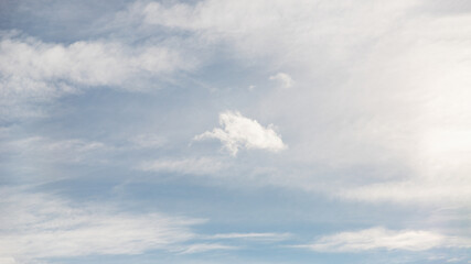 Naklejka na ściany i meble Cirrocumulus clouds in the pale blue sky background