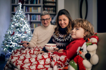 Mom, dad and son are spending a good time together in a winter day