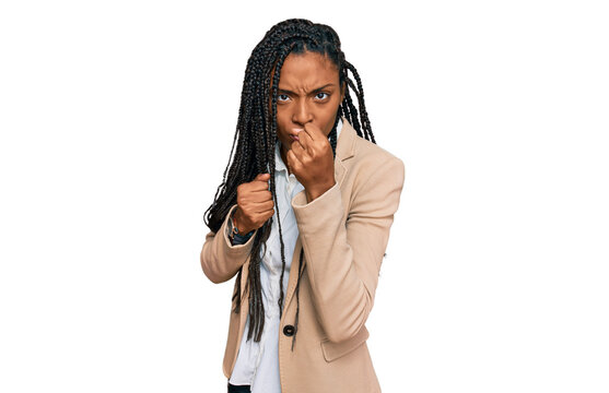 African american woman wearing business jacket ready to fight with fist defense gesture, angry and upset face, afraid of problem - Powered by Adobe