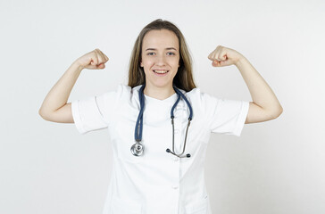 Medicine and health concept. The doctor shows his muscles, demonstrating success.