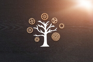 Tree, wooden gears on a dark background. Business project, the mechanism of interaction.
