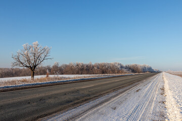 Two-lane road on a sunny December day in Russia