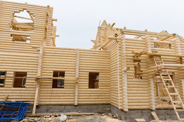 Construction of a Christian church made of wooden treated logs