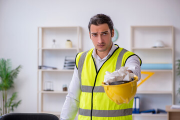 Young male architect working in the office