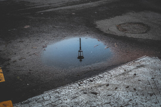 Lamppost reflected in a puddle