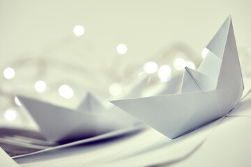 paper boats on the documents