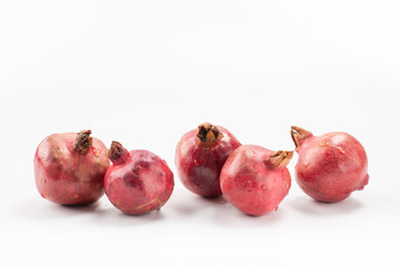 Ripe pomegranates on white