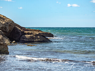 Seascape rock, beach and sea. Travel and Leisure.