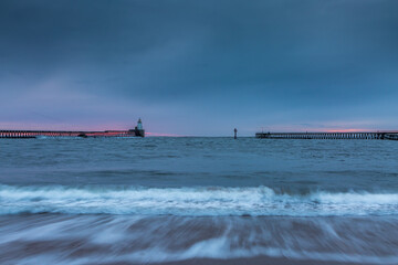 Morning at Blyth beach in Northumberland, England, with the old wooden Pier stretching out to the...