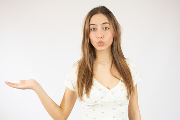 Beautiful caucasian young woman showing product isolate over white background